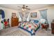 Cozy bedroom with carpet, large windows, and a bed with a colorful patchwork quilt at 919 42Nd Avenue Ne Ln, Hickory, NC 28601