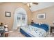 Neutral bedroom with sloped ceilings, a large window, carpet flooring, and a comfortable bed at 919 42Nd Avenue Ne Ln, Hickory, NC 28601