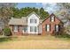 Attractive brick and siding home with a manicured lawn and blossoming trees at 919 42Nd Avenue Ne Ln, Hickory, NC 28601