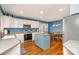 Bright kitchen featuring a center island, white cabinets, stainless steel appliances, and a dining area at 919 42Nd Avenue Ne Ln, Hickory, NC 28601