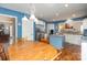 Spacious kitchen features stainless steel fridge, white cabinets, blue walls, wooden table, and an island at 919 42Nd Avenue Ne Ln, Hickory, NC 28601
