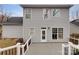 Rear view of the house showing a deck with a railing and a fenced yard at 9501 Brighthaven Ln, Charlotte, NC 28214