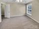 Inviting bedroom with a ceiling fan, neutral decor, and a large window providing a tranquil atmosphere at 9501 Brighthaven Ln, Charlotte, NC 28214