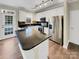 Well-lit kitchen with stainless steel appliances, granite countertops, and a center island at 9501 Brighthaven Ln, Charlotte, NC 28214
