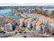 Aerial view of blue condo buildings with a lake, marina, and swimming pool at 1107 Torrence Cir, Davidson, NC 28036