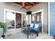 Charming balcony area with comfortable seating, ceiling fan, and serene views of the property at 1107 Torrence Cir, Davidson, NC 28036