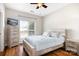Bedroom with hardwood floors, a ceiling fan, and a window providing natural light at 1107 Torrence Cir, Davidson, NC 28036