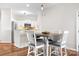 Bright dining area adjacent to the kitchen featuring a table with seating for four at 1107 Torrence Cir, Davidson, NC 28036