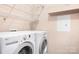 Laundry room with modern LG washer and dryer set and wire shelving at 1107 Torrence Cir, Davidson, NC 28036