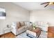 Cozy living room featuring comfortable sofas, natural light, and a stylish coffee table at 1107 Torrence Cir, Davidson, NC 28036