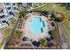 A refreshing swimming pool surrounded by lounge chairs and manicured landscaping at 1107 Torrence Cir, Davidson, NC 28036