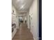 Bright hallway with wood-look floors leads to open living spaces and bedrooms at 1429 Nia Rd, Charlotte, NC 28215