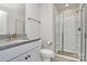 Bathroom featuring a double vanity, granite countertops, white cabinets, and glass shower at 2408 Napa Ter, Clover, SC 29710