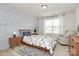 Cozy bedroom featuring fun wallpaper, stylish decor, and a patterned area rug at 2408 Napa Ter, Clover, SC 29710