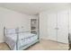 Cozy bedroom with light-colored walls, carpet, and a charming bed frame, plus a large double-door closet at 2408 Napa Ter, Clover, SC 29710