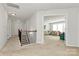 Second floor hallway leads to a cozy lounge area with ample seating and natural light, perfect for relaxation at 2408 Napa Ter, Clover, SC 29710