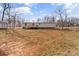 Back of home featuring wooden deck, spacious yard, and storage shed at 255 Liberty Estates Ln, Taylorsville, NC 28681