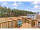 View from the backyard deck overlooking an expansive yard with mature trees and storage shed at 255 Liberty Estates Ln, Taylorsville, NC 28681