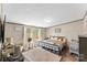 Cozy bedroom with neutral walls, wood-look floors, and lots of natural light, creating a comfortable and serene retreat at 255 Liberty Estates Ln, Taylorsville, NC 28681