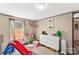 Cheerful bedroom with toys, hardwood floors, and a window offering natural light at 255 Liberty Estates Ln, Taylorsville, NC 28681