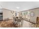 Bright dining space boasting wood-look floors and natural light, creating a perfect blend of comfort and style at 255 Liberty Estates Ln, Taylorsville, NC 28681