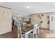 Charming dining area with wood-look floors, flowing into the open-concept living space, creating a warm and inviting atmosphere at 255 Liberty Estates Ln, Taylorsville, NC 28681