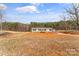 Charming single-story house with a welcoming porch, set in a peaceful country location surrounded by open land and trees at 255 Liberty Estates Ln, Taylorsville, NC 28681
