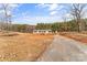 Quaint single-story home with a gravel driveway, offering a serene country living experience and lots of land at 255 Liberty Estates Ln, Taylorsville, NC 28681