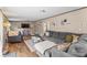 Inviting living room with hardwood floors and a comfortable gray sectional sofa at 255 Liberty Estates Ln, Taylorsville, NC 28681