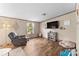 Cozy living area with a relaxing armchair, hardwood floors and plenty of natural light at 255 Liberty Estates Ln, Taylorsville, NC 28681