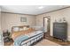 Comfortable bedroom with ample natural light, hardwood floors, and a cozy bed at 255 Liberty Estates Ln, Taylorsville, NC 28681