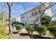 This backyard features a patio area with plenty of room for entertaining and is surrounded by lush landscaping at 6816 Charter Hills Rd, Charlotte, NC 28277