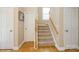 Hallway featuring a carpeted staircase and neutral wall colors at 6816 Charter Hills Rd, Charlotte, NC 28277