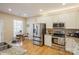 Well lit kitchen featuring stainless steel appliances and an adjacent breakfast area at 6816 Charter Hills Rd, Charlotte, NC 28277