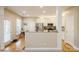 Bright kitchen featuring stainless steel appliances, granite countertops, and hardwood floors at 6816 Charter Hills Rd, Charlotte, NC 28277