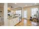 Open concept kitchen featuring a stainless steel dishwasher and granite countertops at 6816 Charter Hills Rd, Charlotte, NC 28277