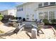 Large backyard patio area with plenty of room for entertaining and a grill for outdoor cooking at 6816 Charter Hills Rd, Charlotte, NC 28277