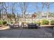 Large backyard patio area with plenty of room for entertaining and a private fence surround the property at 6816 Charter Hills Rd, Charlotte, NC 28277