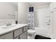 A full bathroom with a tub and shower combo and a sink with a gray cabinet base at 838 Foxglove Ln, York, SC 29745
