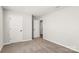 An empty bedroom with neutral paint, carpet, and white doors awaits personalization at 838 Foxglove Ln, York, SC 29745