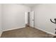 Cozy bedroom with plush carpet, a neutral color palette, and an open doorway at 838 Foxglove Ln, York, SC 29745