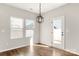 Inviting dining area with modern light fixture and natural light, perfect for enjoying Gathering meals at 838 Foxglove Ln, York, SC 29745