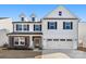 Charming two-story home with black shutters, neutral siding, and a two-car garage at 838 Foxglove Ln, York, SC 29745