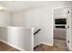 Open hallway leading to living area, showcasing hardwood floors and neutral paint at 838 Foxglove Ln, York, SC 29745