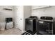 Efficient laundry room featuring modern washer and dryer, storage, and functional design at 838 Foxglove Ln, York, SC 29745