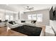 Spacious living room featuring a large white sectional, black accents, and ample natural light at 838 Foxglove Ln, York, SC 29745