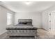 The main bedroom includes carpet floors, natural light, and a stylish gray velvet bed at 838 Foxglove Ln, York, SC 29745