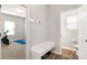 Hallway featuring a mudroom area with hooks, bench, and access to a bathroom and exercise room at 838 Foxglove Ln, York, SC 29745