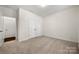 This is a carpeted bedroom that includes an ensuite closet and a large door to the house at 10159 Lakeshore Dr, Lancaster, SC 29720