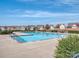 Large community pool with clear blue water and neighborhood homes in background at 10159 Lakeshore Dr, Lancaster, SC 29720